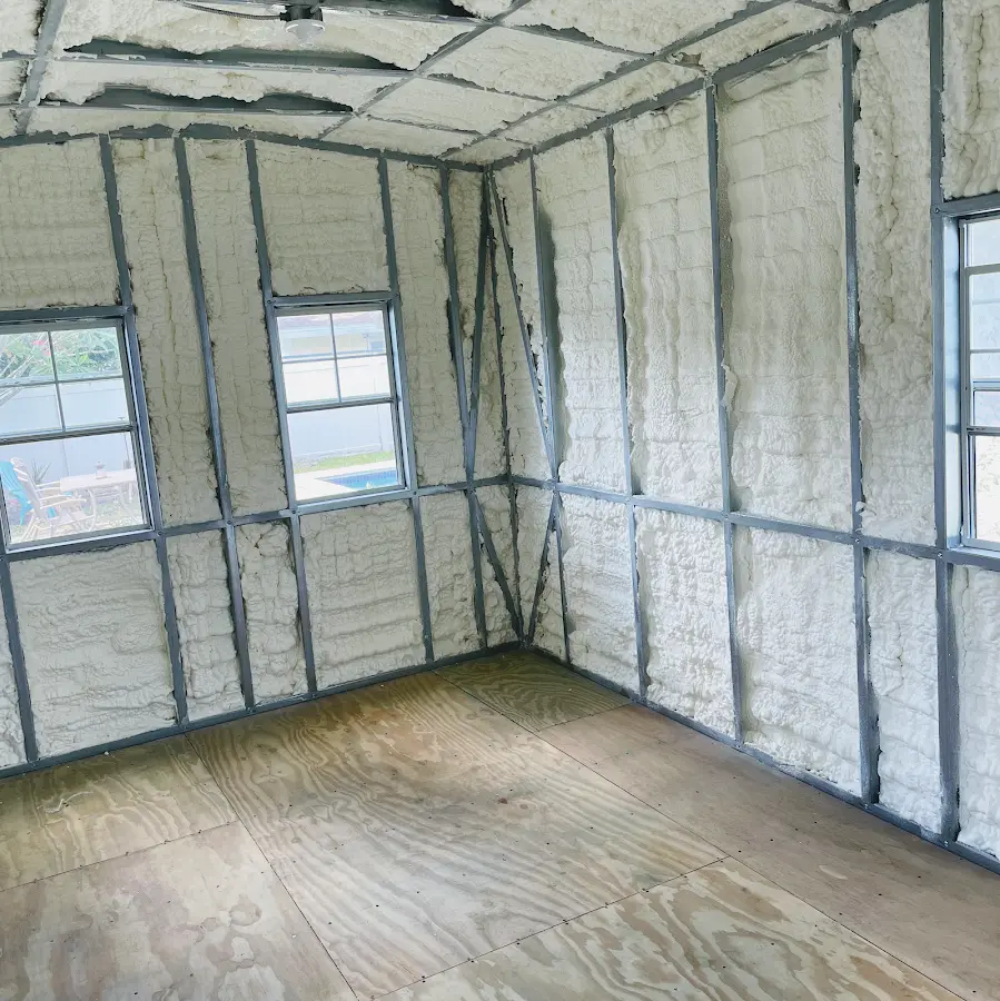 Closed-cell spray foam insulation applied to wall cavities in a residential project in Traverse City